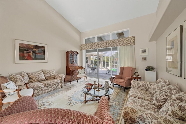 living room featuring high vaulted ceiling