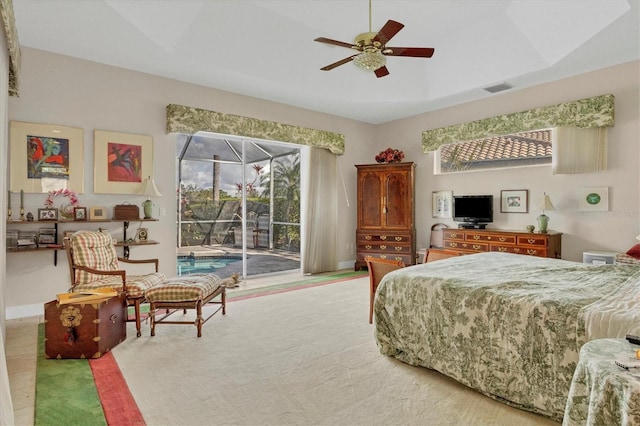 carpeted bedroom featuring access to outside and ceiling fan