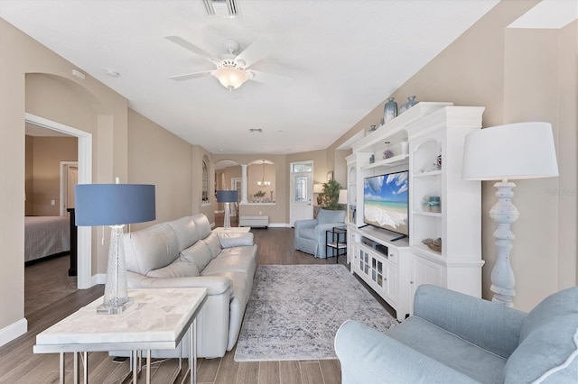 living room featuring ceiling fan and wood-type flooring