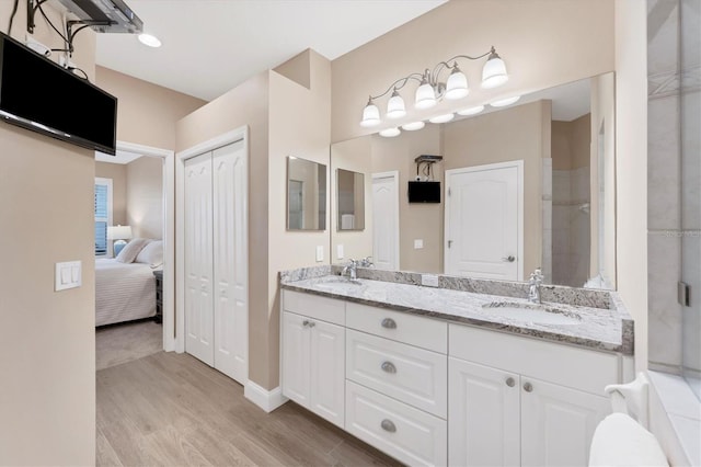 bathroom featuring vanity and hardwood / wood-style flooring