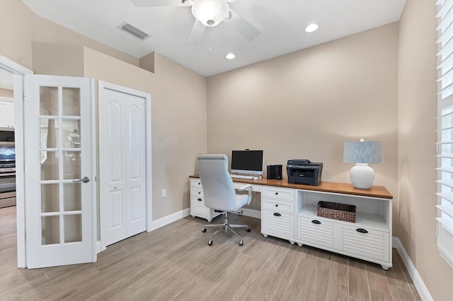 office space with ceiling fan and light hardwood / wood-style flooring