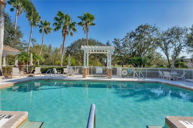 view of pool with a pergola and a patio