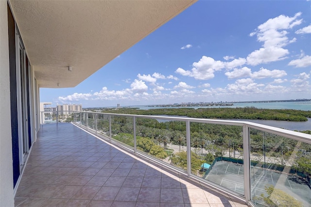 balcony featuring a water view