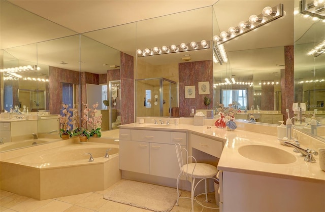 bathroom with tile patterned flooring, vanity, and separate shower and tub