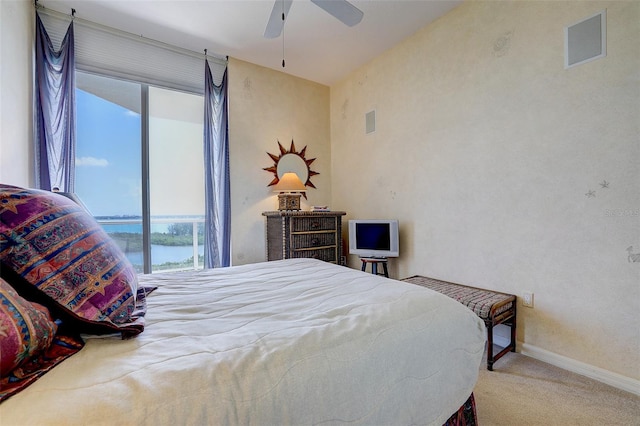 bedroom featuring light colored carpet and ceiling fan