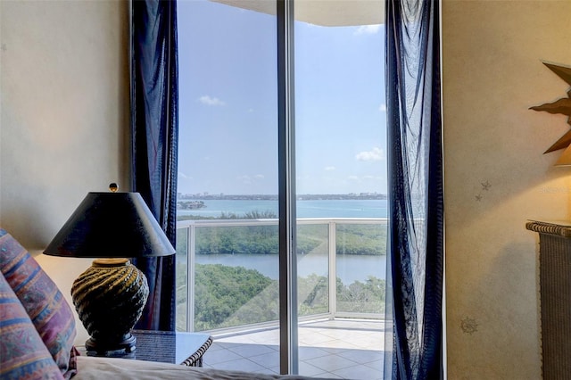 bedroom featuring a water view