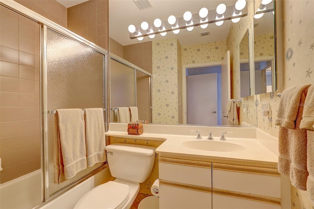 full bathroom with shower / bath combination with glass door, vanity, and toilet