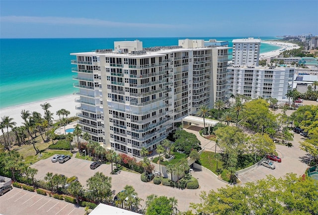 view of property featuring a water view and a view of the beach