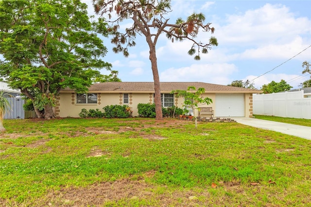 ranch-style home featuring a garage and a front lawn