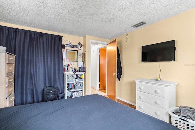 unfurnished bedroom featuring a textured ceiling