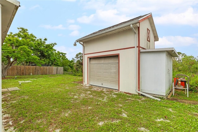 garage featuring a yard