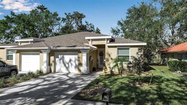 view of front facade with a front lawn and a garage