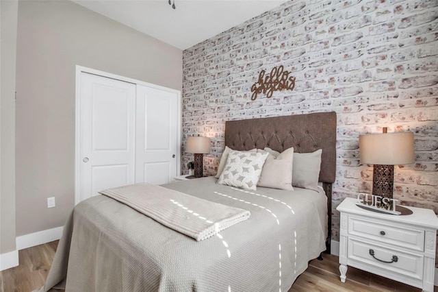 bedroom featuring a closet and wood-type flooring