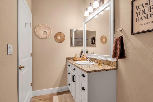 bathroom with wood-type flooring and vanity