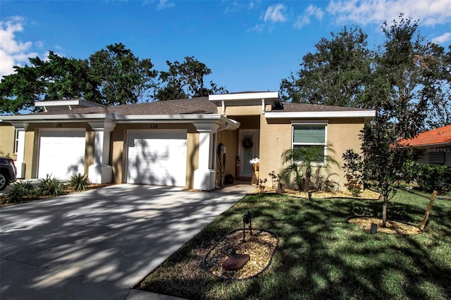 single story home with a garage and a front yard