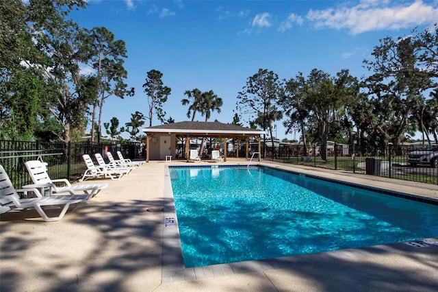 view of swimming pool with a patio area