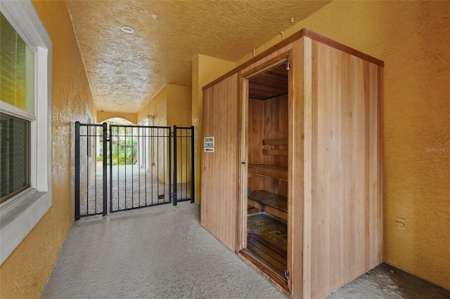 interior space featuring a textured ceiling