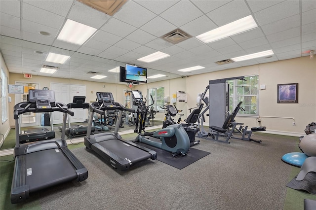 exercise room featuring a drop ceiling