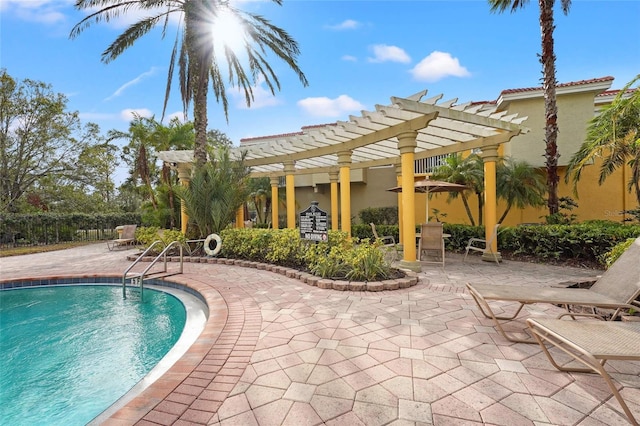 view of swimming pool with a pergola and a patio area