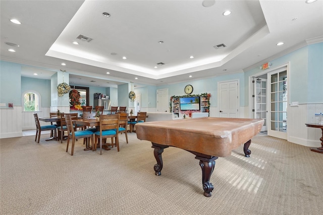 game room featuring french doors, a raised ceiling, crown molding, and billiards