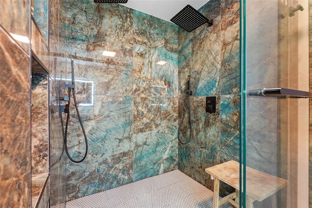 bathroom featuring a tile shower