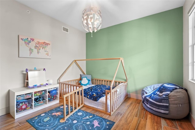 bedroom featuring a notable chandelier