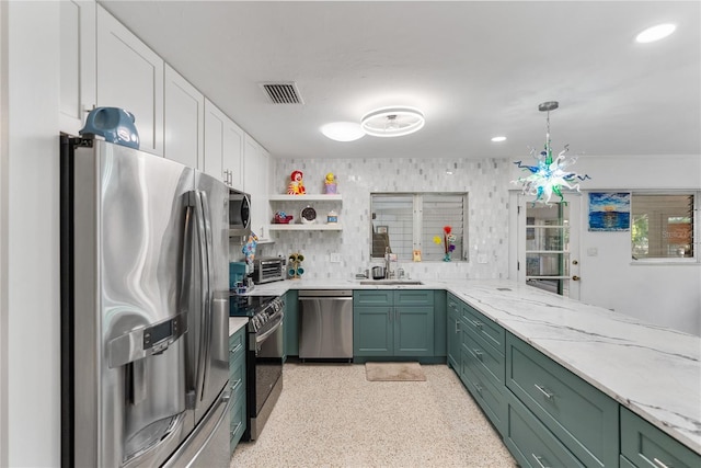 kitchen featuring green cabinets, sink, white cabinets, and appliances with stainless steel finishes