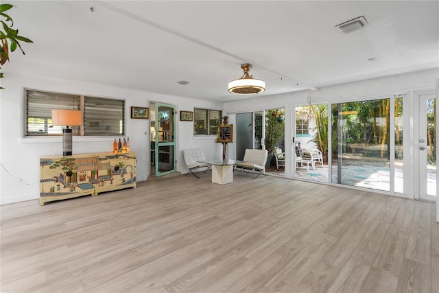 interior space featuring light hardwood / wood-style floors and french doors