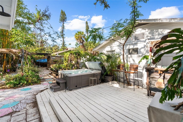 deck with a hot tub