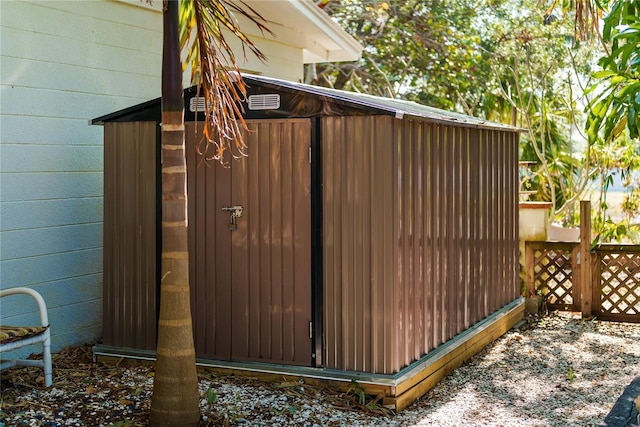 view of gate with a storage shed