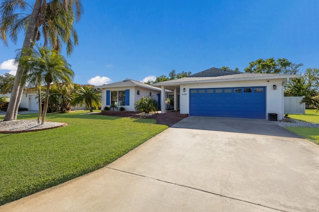 ranch-style home featuring a front yard and a garage