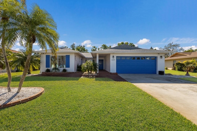 ranch-style home with a garage and a front lawn