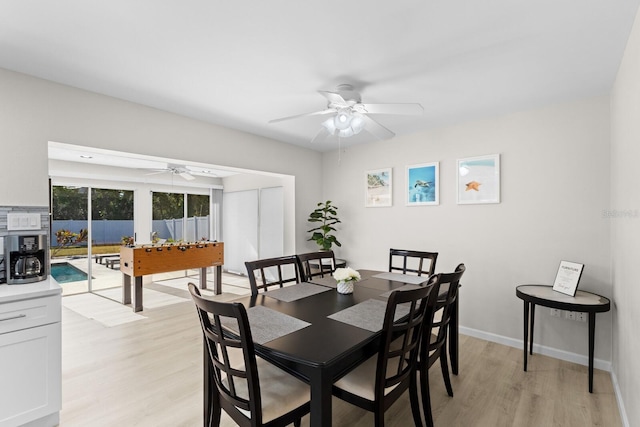 dining space featuring ceiling fan and light hardwood / wood-style floors