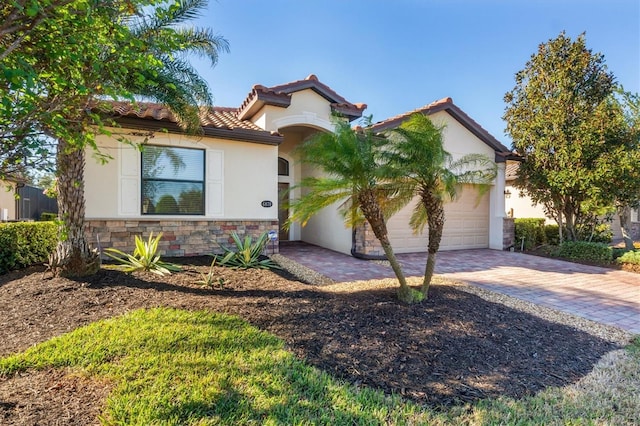 mediterranean / spanish-style home featuring a garage