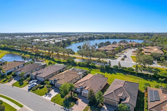 birds eye view of property featuring a water view