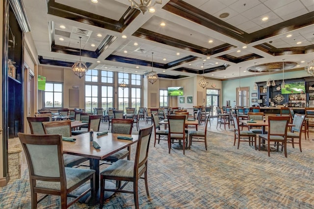 dining space featuring a towering ceiling, beamed ceiling, crown molding, and coffered ceiling