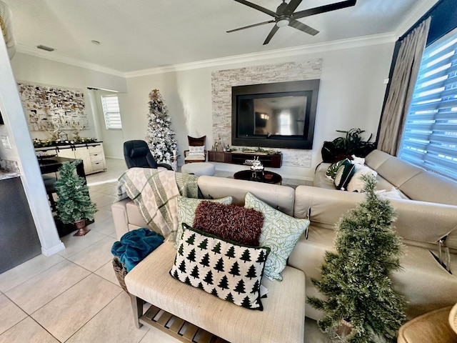 tiled living room with ceiling fan and ornamental molding