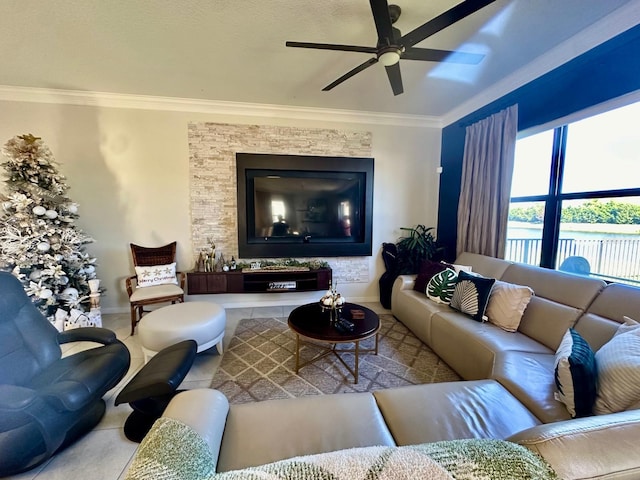 living room with ceiling fan and crown molding