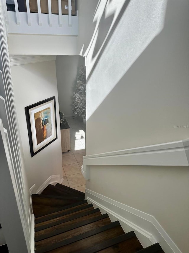 staircase with tile patterned floors