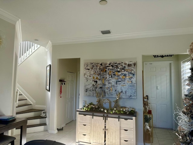 interior space featuring crown molding and light tile patterned floors