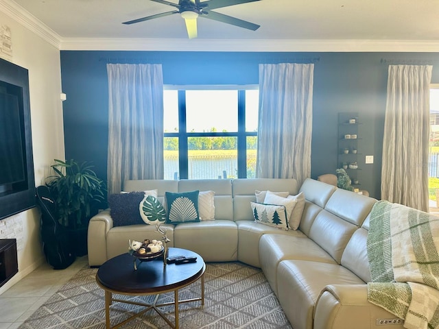 tiled living room featuring plenty of natural light, ornamental molding, and ceiling fan