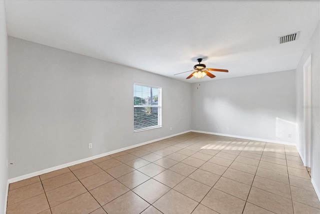 unfurnished room featuring ceiling fan and light tile patterned floors