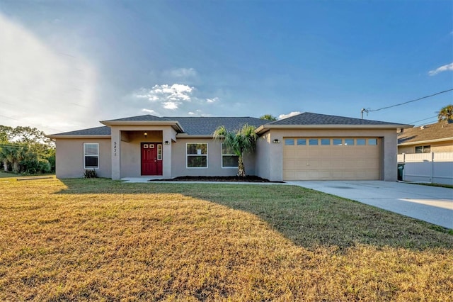 view of front facade with a front yard and a garage