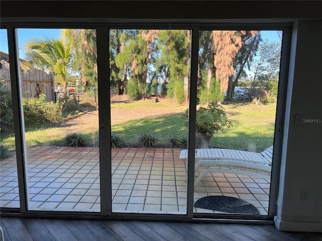 doorway to outside with wood-type flooring