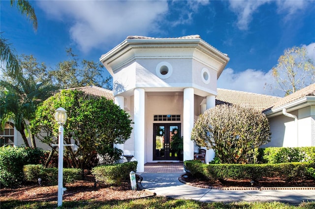 entrance to property featuring french doors