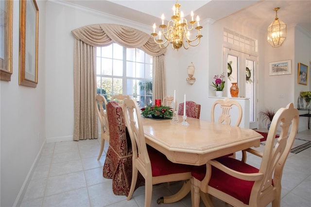 dining room featuring crown molding, light tile patterned flooring, and a chandelier