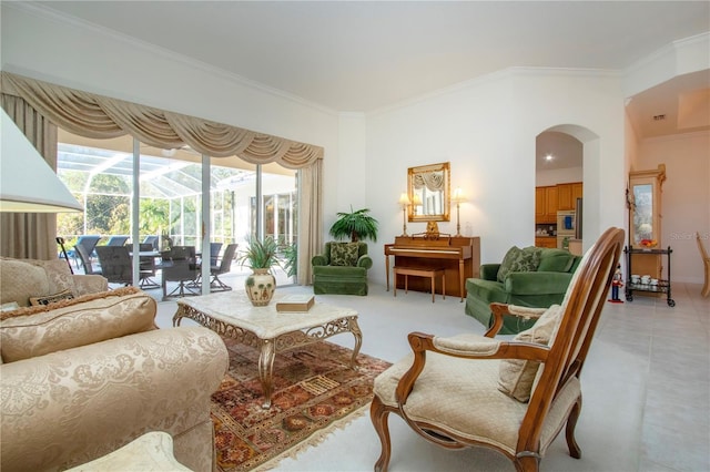 living room featuring light tile patterned floors and crown molding