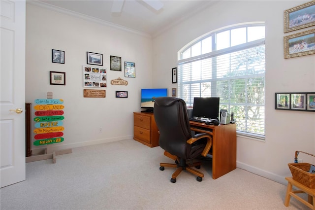 carpeted office featuring ceiling fan and crown molding