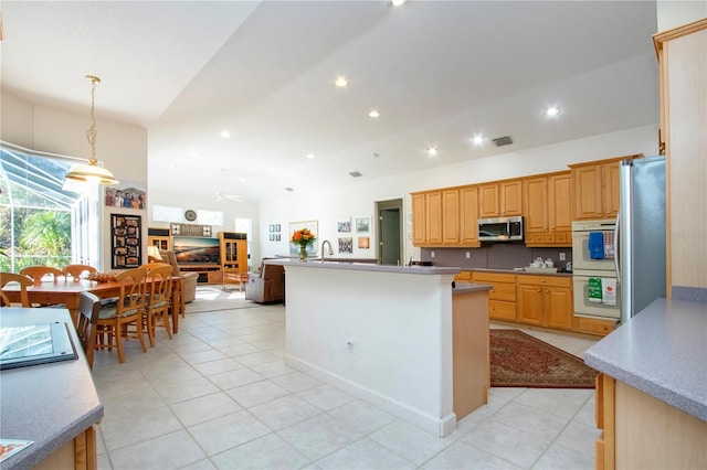 kitchen featuring appliances with stainless steel finishes, ceiling fan, sink, light tile patterned floors, and pendant lighting