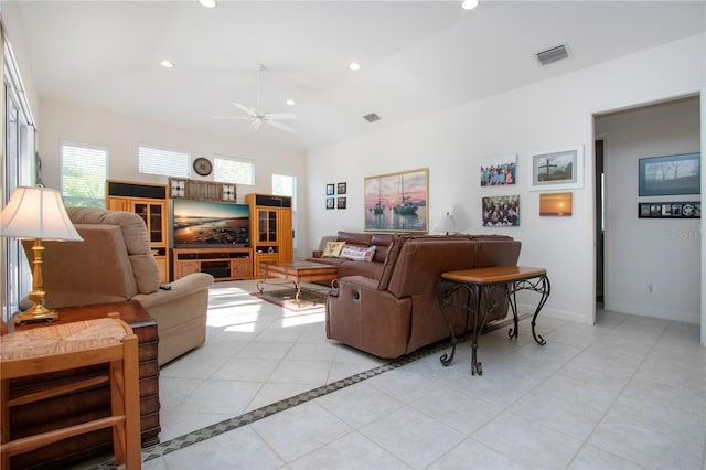 tiled living room featuring ceiling fan and a wealth of natural light